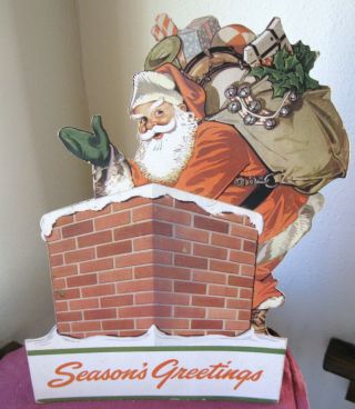 Vintage Cardboard Christmas Wall Decoration Santa W Bag Of Toys.  Has Stand.