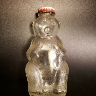 Vintage Snow Crest Bear Bank/clear Glass Bottle 7” Tall.