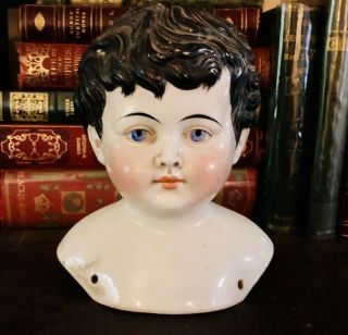 Porcelain China Bisque Doll Head - Black Hair - Blue Eyes.  V.  G.
