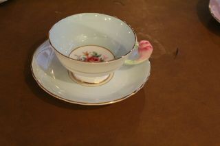 Paragon Light Blue And White Rose Handle Teacup And Saucer