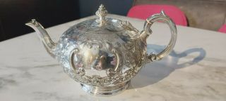 An Antique Silver Plated Embossed Tea Pot By Martin Hall &co.  Circa 1854.