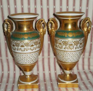 Pair Antique Paris Porcelain Veiux Empire Green And Gold Footed Urn Vases