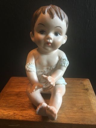 Vintage/ Antique Piano Baby Figurine Doll Porcelain 4.  5 " Bisque Ceramic Brown