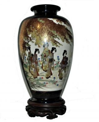 A Pair Japanese Satsuma Vases Decorated With Mirrored Scene Of Ladies,  Tree.