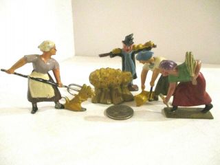 4 Vintage,  Hard To Find,  French Lead Toy Farm Figures W/ One Manoil Hay Stack.