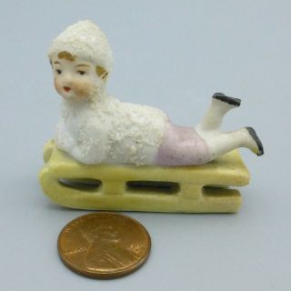 Vintage Miniature Bisque Snow Baby On Sled Christmas Figurine Putz Germany 2″