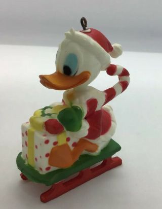 Vintage Walt Disney Donald Duck Christmas Ornament Plastic Figurine Sledding