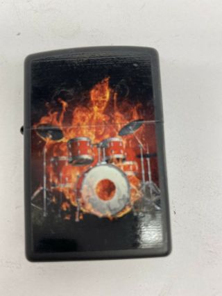 Black Zippo Lighter With Devil And Drum Set Image