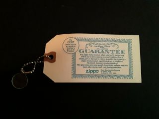 Zippo 1980 Encased Penny Guarantee Tag.  " The Cent Never Spent To Repair A Zippo