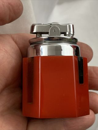 Vintage Ronson Yorker Table Lighter With A Red Catalin Base