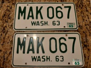 1963 Washington State License Plates.  Near Matched Pair.  White/green.