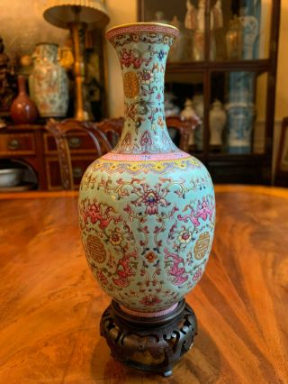 An Chinese Qing Dynasty Famille Rose Porcelain Vase With Stand,  Marked