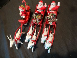 3 Vintage Santa Clauses In Sleighs Pulled By Reindeer Gifts