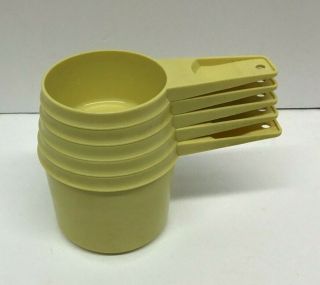 Partial Set Of Vintage Yellow Tupperware Measuring Cups