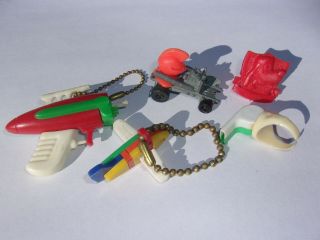 Group Of Vintage Plastic Toys Mattel Zowee Car Pluto Ring Gun & Plane Keychain