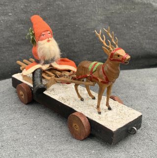 Antique German Pull Toy Of Composition Santa On Wooden Sled Hauled By A Reindeer