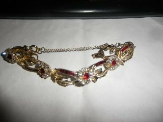 Vintage Signed Coro Gold Tone With Red & Clear Rhinestones And Safety Chain.