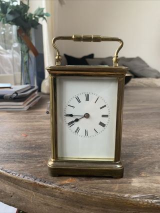 A Gilt Brass Carriage Clock Plain Case,  White Enamel Dial