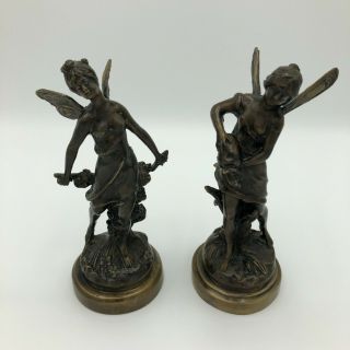 A Signed Bronze Winged Female Figures In The Style Of Auguste Moreau