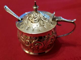 A Solid Silver,  Embossed Mustard Pot With Spoon.  Chester 1897.  Spoon 1898