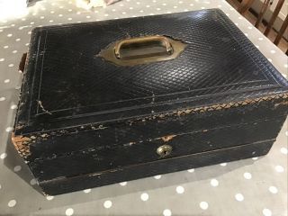 An Antique Leather And Brass Writing Box