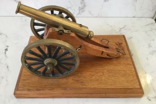 Vintage Brass And Wood Cannon On A Wooden Base