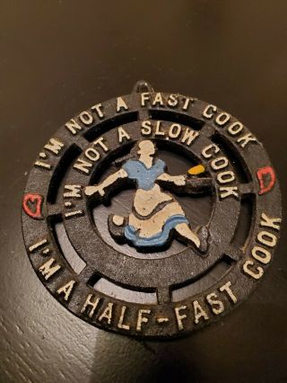 Vintage Cast Iron Trivet I’m Not A Fast Cook I’m Not A Slow Cook.  Usa 5”