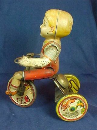 Antique Wind Up Unique Art Kiddy Cyclist Tricycle Pressed Steel
