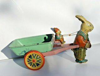 Antique Tin Lithograph Easter Rabbit Cart With Rabbit Driver And Metal Wheels