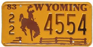 Vintage Orange Wyoming 1983 License Plate,  4554,  Cowboy,  Bucking Horse