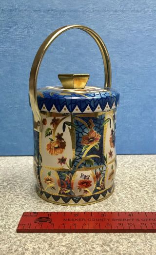 Vintage Flowered Blue And Gold Trimmed Covered Tin Container