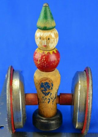 Vintage Push Toy - Big Metal Wheels And A Wooden Clown With Weighted Base