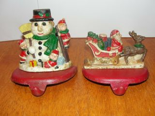 Vintage Set 2 Cast Iron Christmas Stocking Hangers Holders Santa Snowman Euc