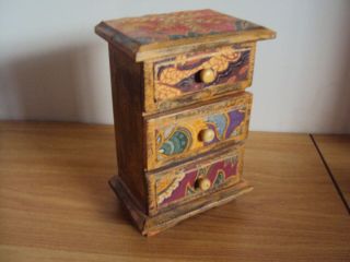A Vintage Wooden Decorated Miniature Chest Of Draws