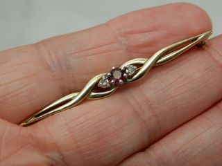A 9 Ct Gold Antique Diamond And Ruby Brooch