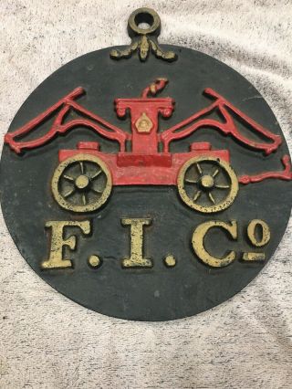 F.  I.  Co.  Fire Insurance Sign 11” Round Cast Iron Fireman