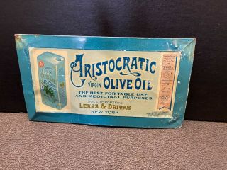 Lekas & Drivas Aristocratic Olive Oil.  Toc 5 " X 9 ".  Wrinkles/scuff Marks.
