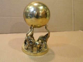 3 Elephants Brass Stand Trunks Up Holding A Brass Sphere Vintage