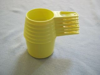 6 Vintage Yellow Tupperware Measuring Cups