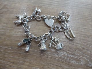Vintage Solid Silver Charm Bracelet With 9 Silver Charms