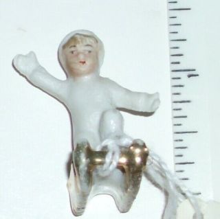 Antique German Bisque Baby Kneeling On Sled Snow Baby