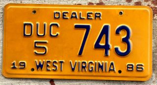 1986 Blue On Orange West Virginia Car Dealer [duc] License Plate