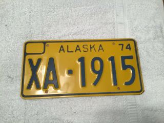 Alaska License Plate Tag.  Paper Says Govt Exempt Tag 1974
