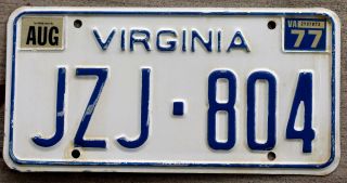 6 - Digit Blue On White Virginia License Plate With A 1977 Sticker