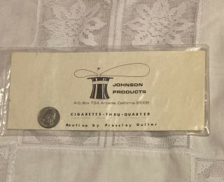 Vintage Early Johnson Products Cigarette Thru Quarter,  Shows The Face,  Ca 1973