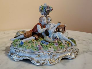 Antique Fabris Porcelain Figure Of Boy & Girl With Bird,  Cage & Flowers