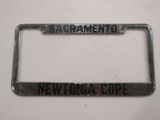 Vintage Sacramento Newton A Cope Oldsmobile Dealership License Plate Frame Metal