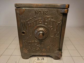 B - 18 Antique Cast Iron 1909 Nicol & Co " No.  12 White City Puzzle Safe " Bank