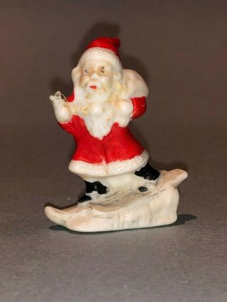 Antique Bisque German Snow Baby Santa Skiing On A Slope