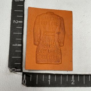Vtg C 1910s Old Saying Cut Coat Accord To Cloth Quote Tobacco Leather Patch 21af